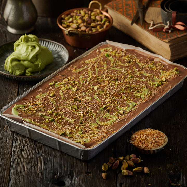 Dubai Style Pistachio Brownie with rich dark chocolate, roasted pistachios, milk chocolate topping, pistachio cream swirl, chopped pistachios, and fried kunafa strands